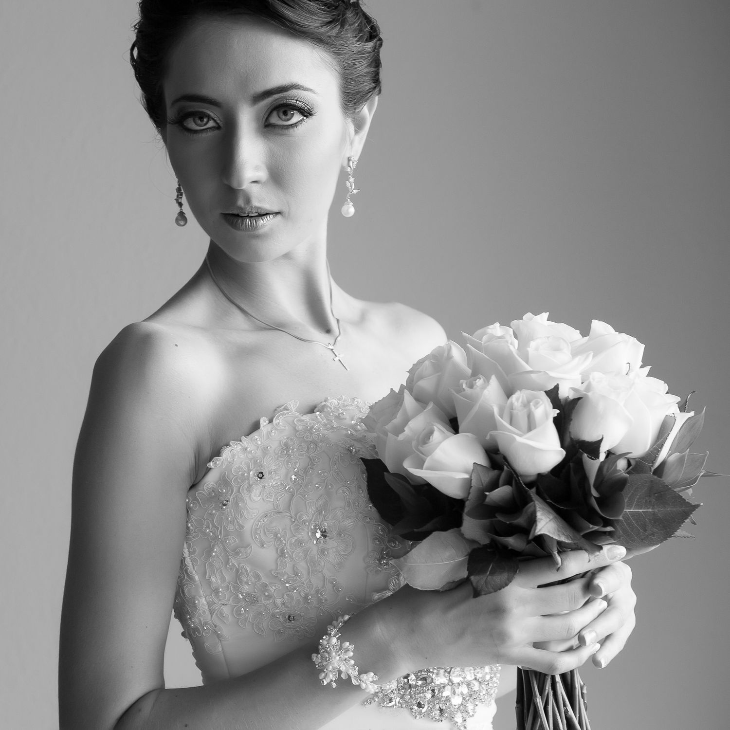 Classic bridal portrait with white rose bouquet in black and white.