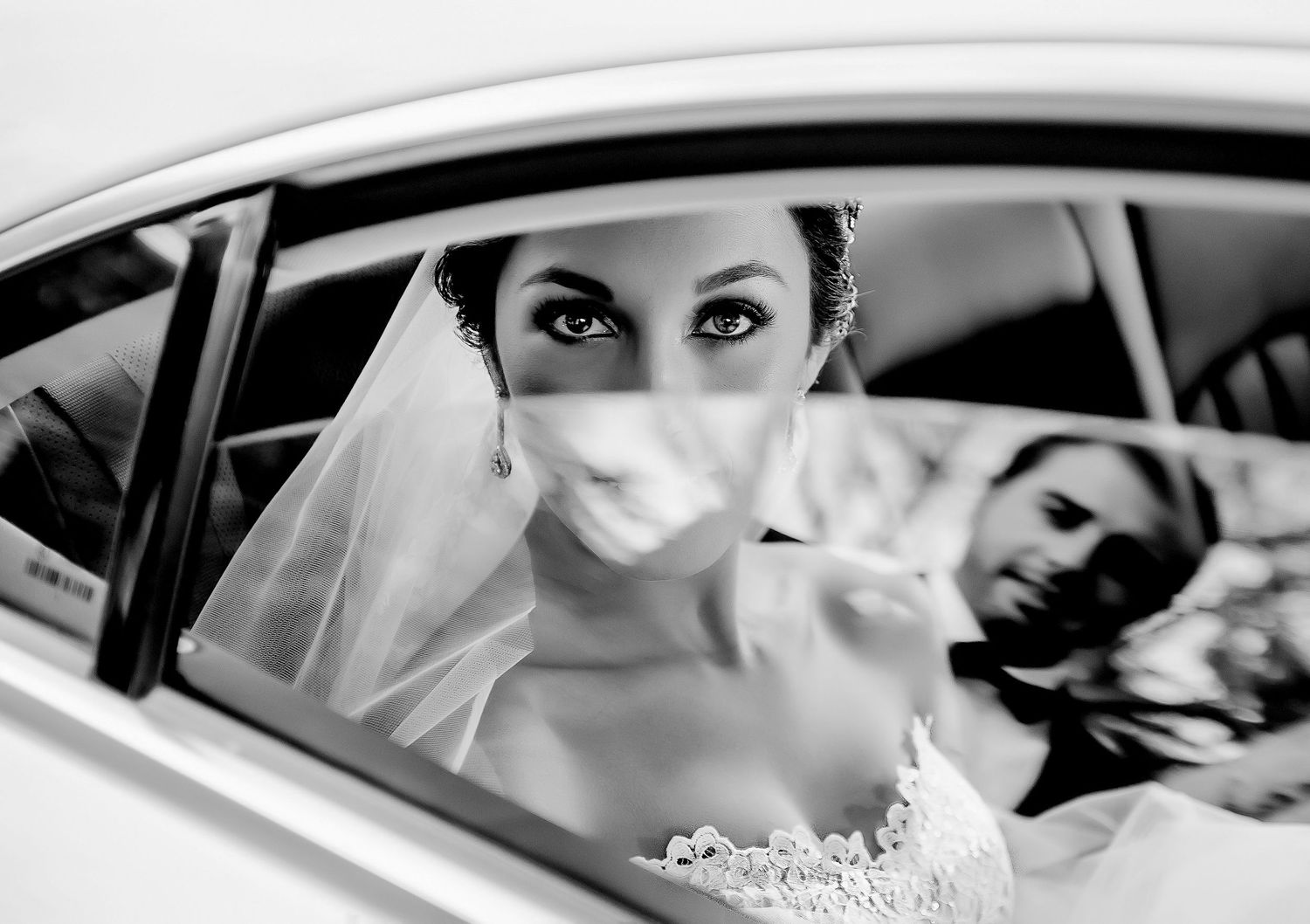 Black and white wedding photography collage showing moments of a couple in a car and intimate details.