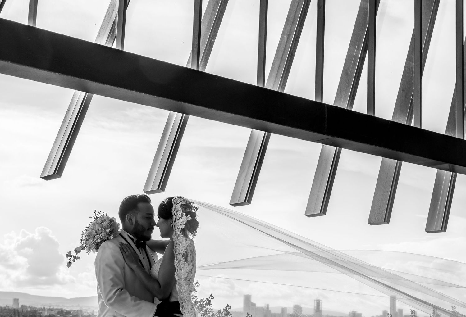 Modern architectural wedding venue with geometric lines and natural lighting.