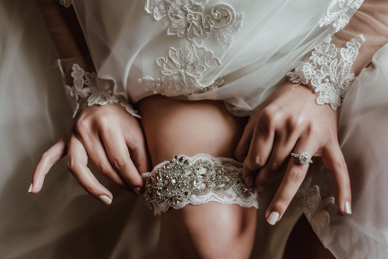 Detailed shots of intricate lace wedding dress beadwork and embellishments.