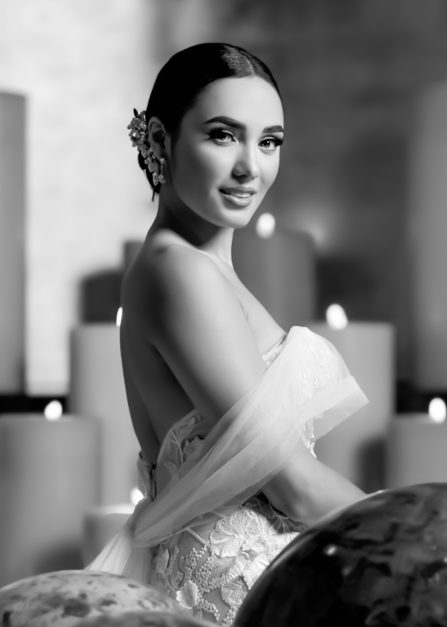 Classic black and white bridal portrait showing elegant strapless gown and delicate hair accessories.