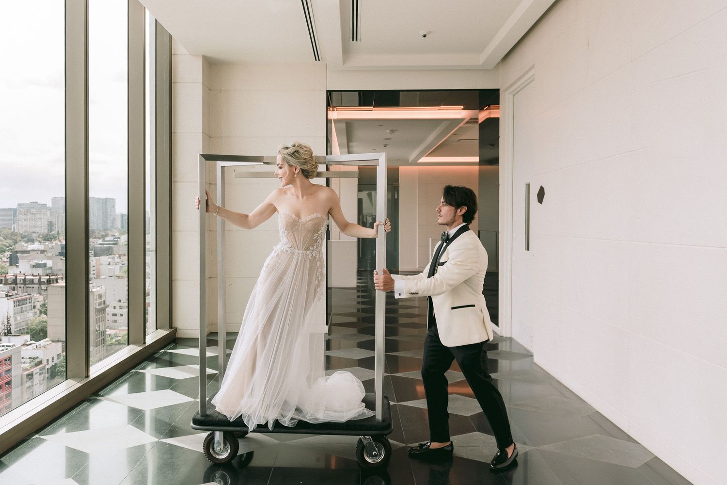 Modern minimalist wedding photoshoot in bright interior hallway.