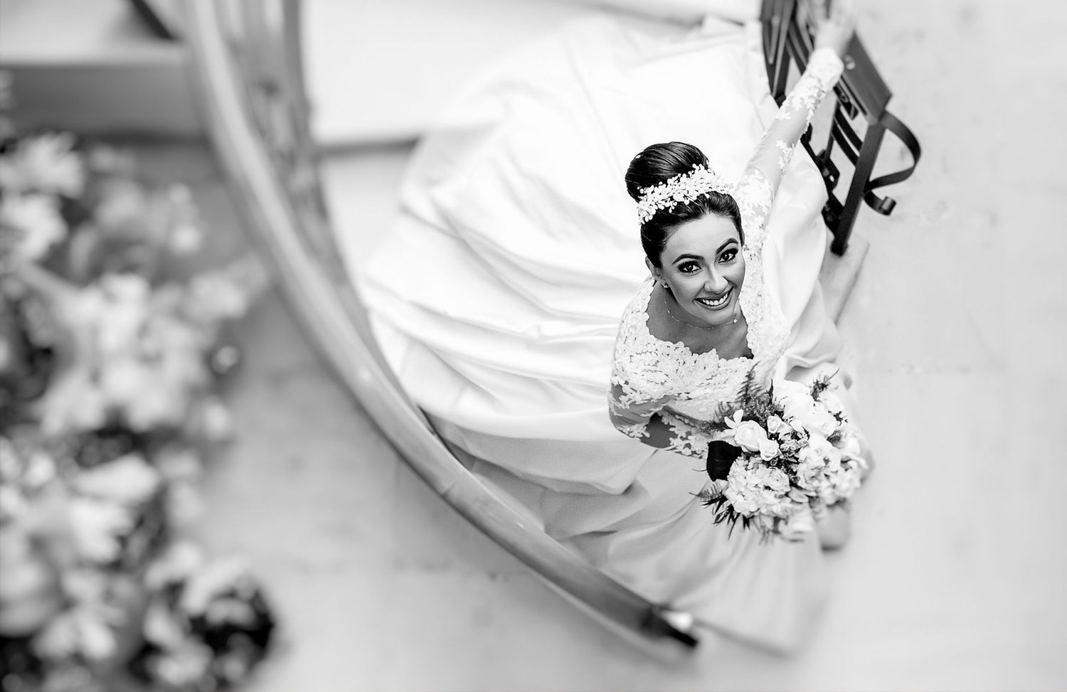 Black and white aerial views of wedding couples creating artistic geometric compositions.