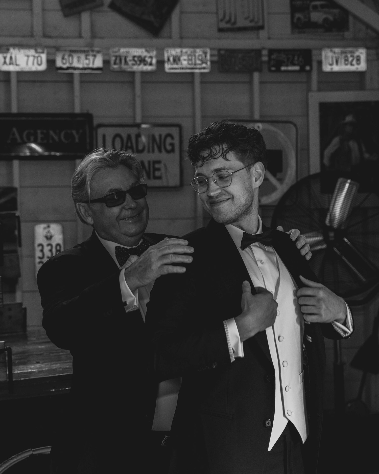 A black and white photo series showing people in formal attire at what appears to be a social gathering or event.