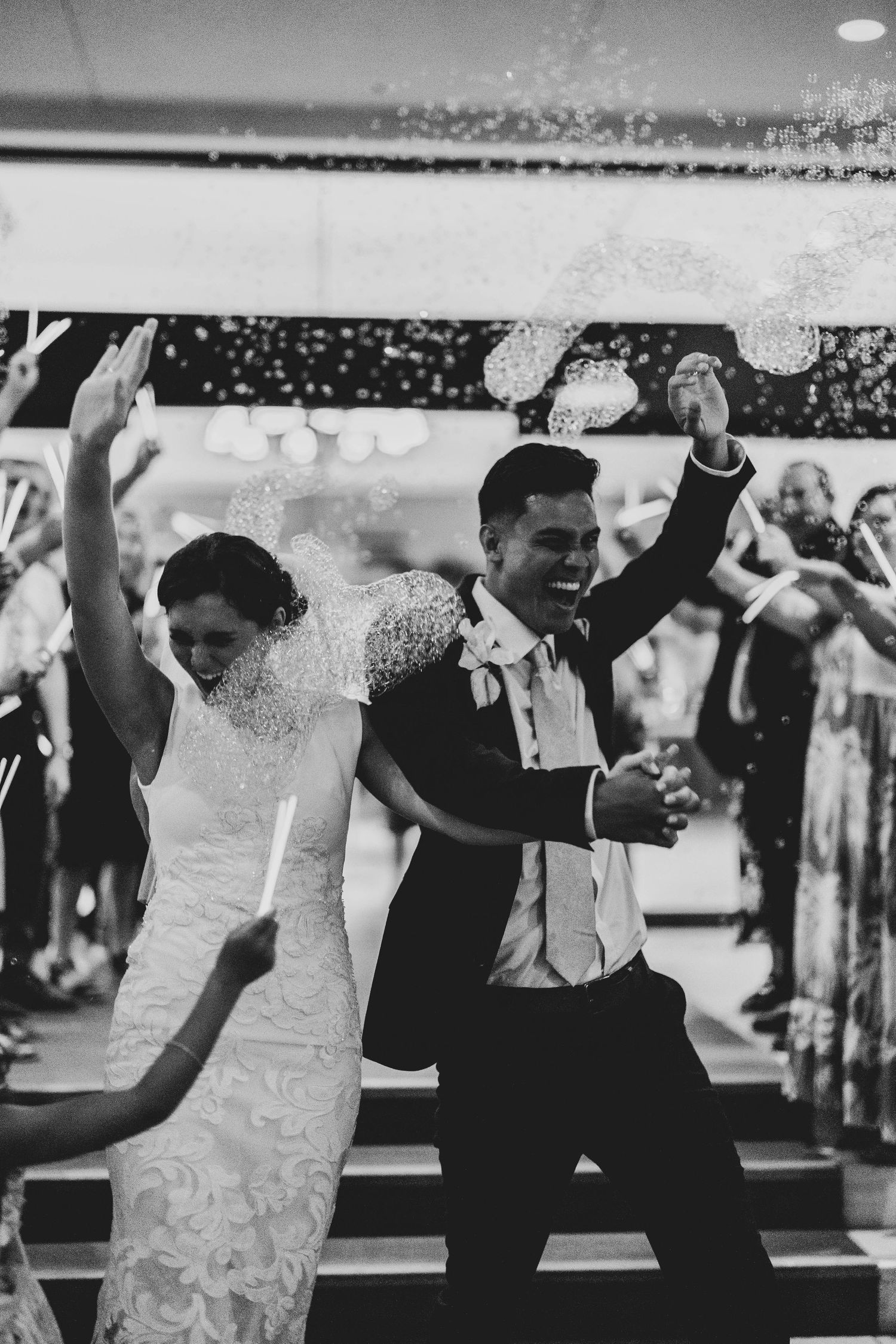 Black and white photos show a bride and groom dancing together at their wedding reception celebration.