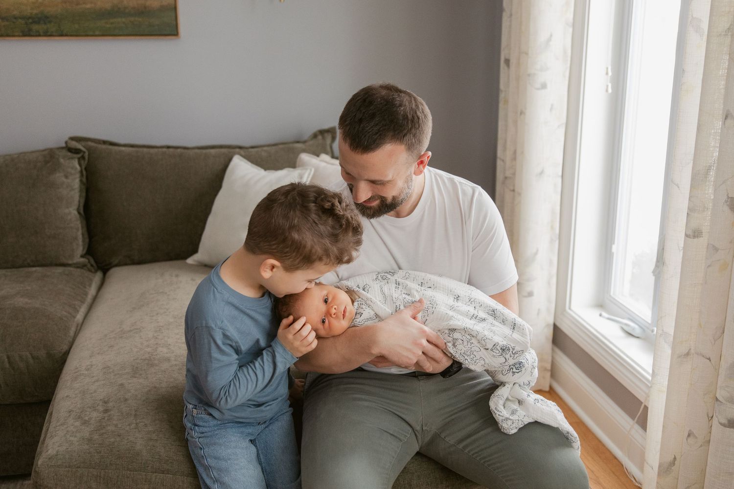 Serene nursery interior with natural light and comfortable seating.