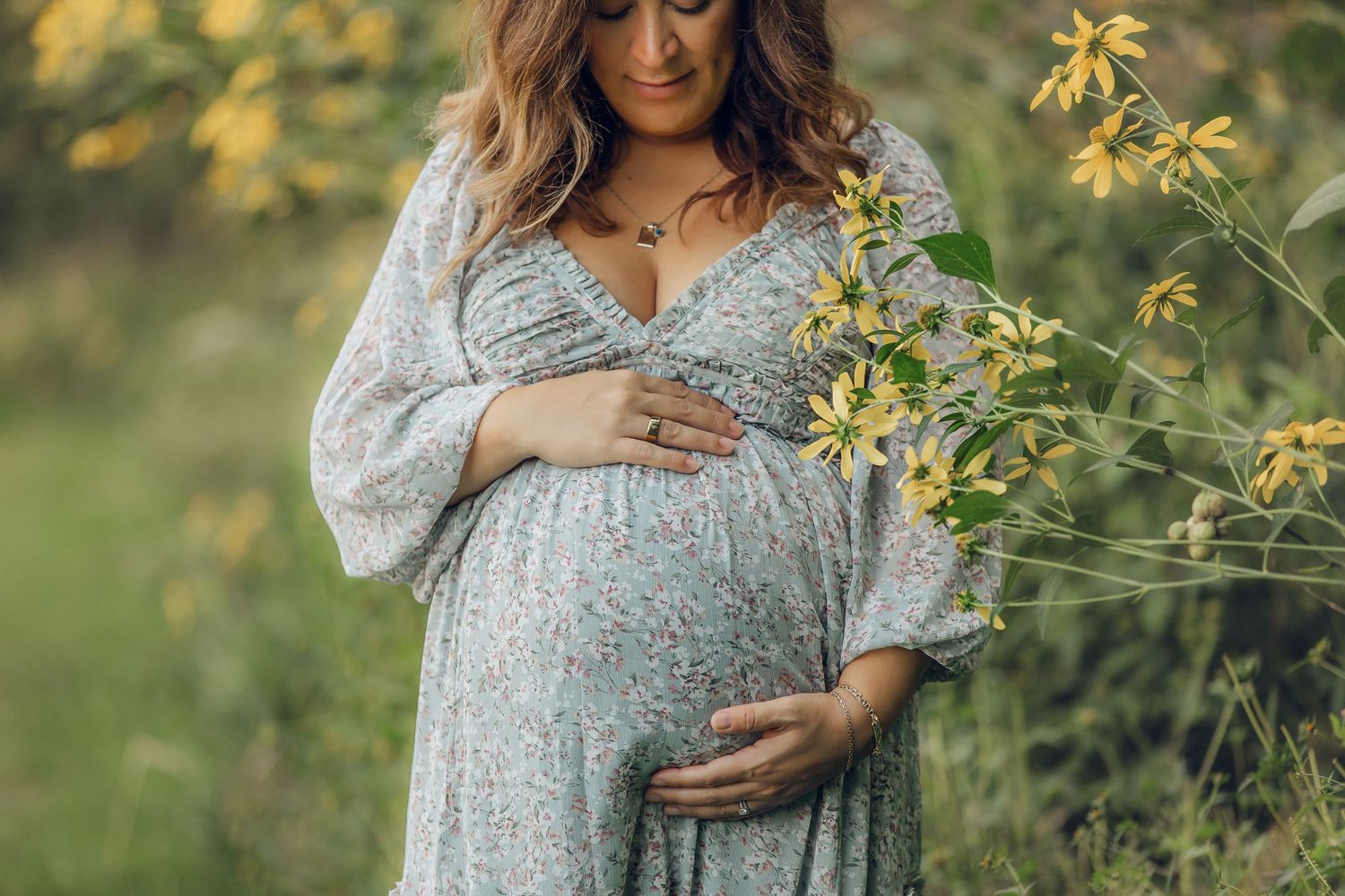 A series of maternity portraits showing a woman in a floral dress among yellow flowers.