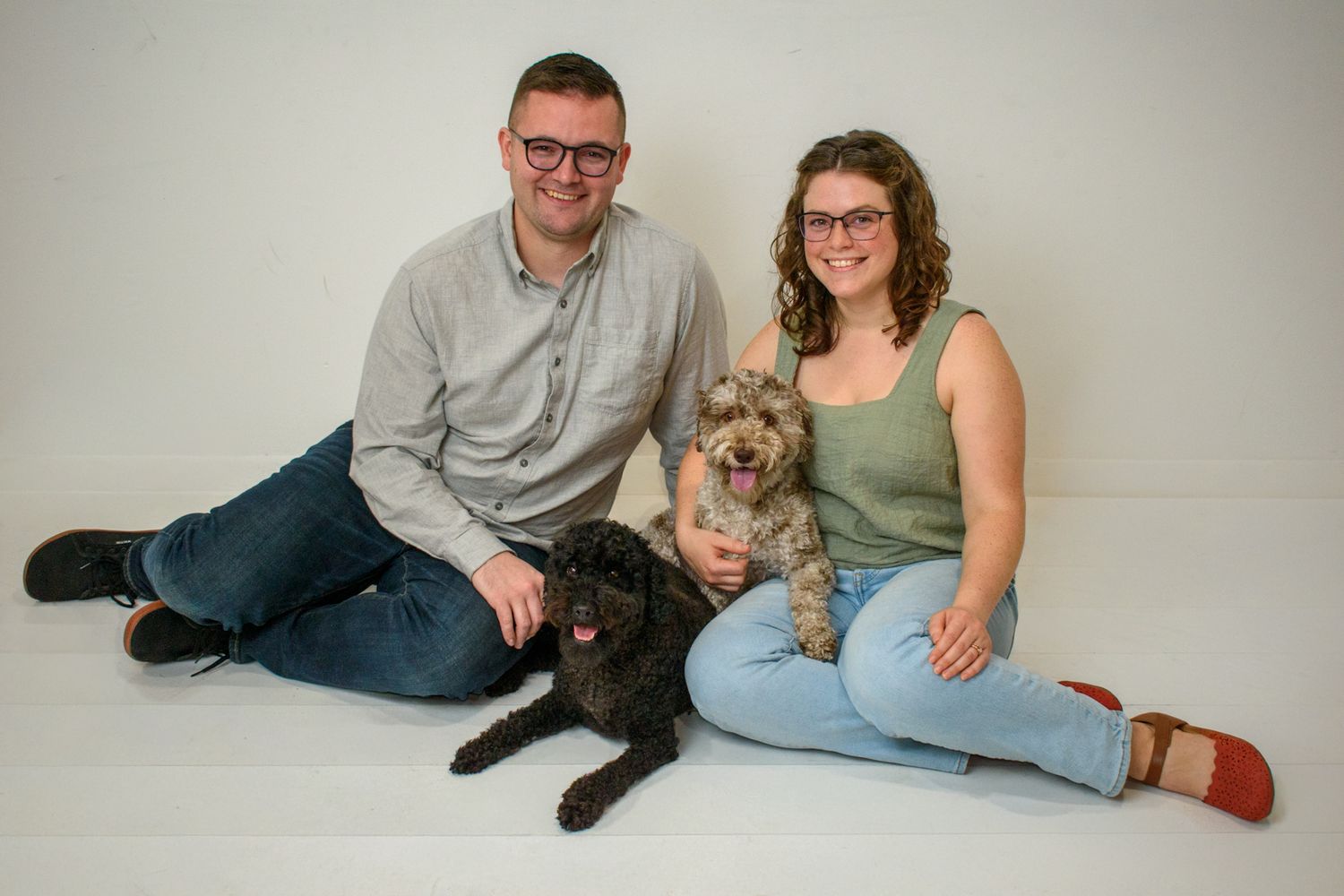 Studio portrait of family with their two beloved pets.
