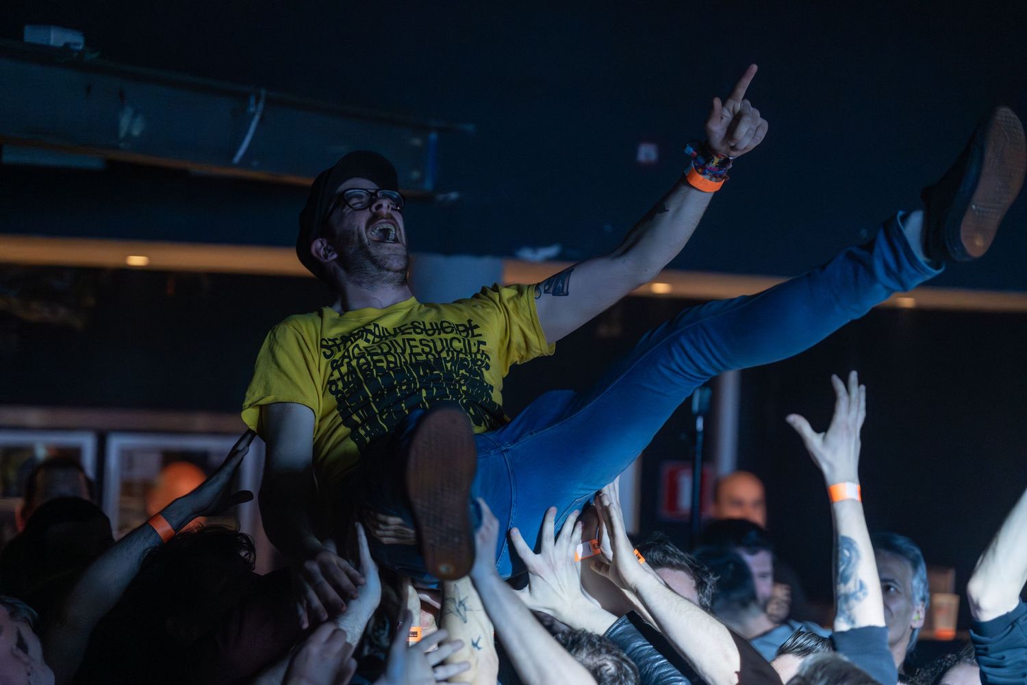 A man crowd surfs during a live concert in Belgium.