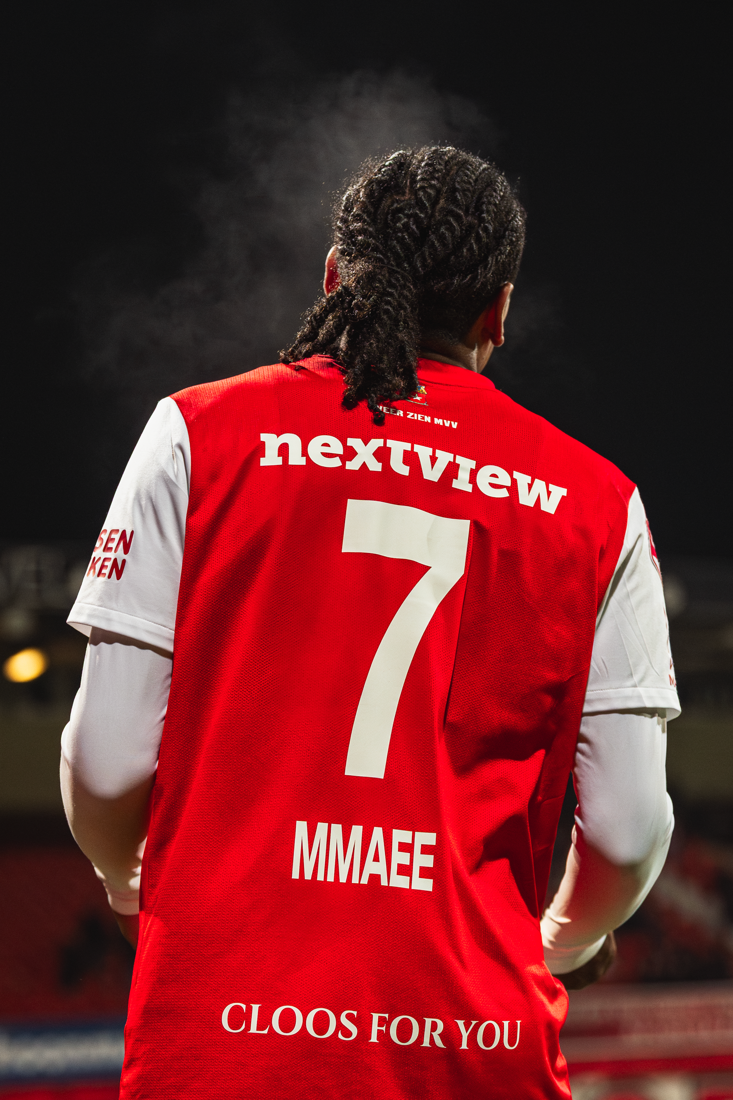 A red and white soccer jersey with number 7 and 'nextview' text shown from different back angles on the field.