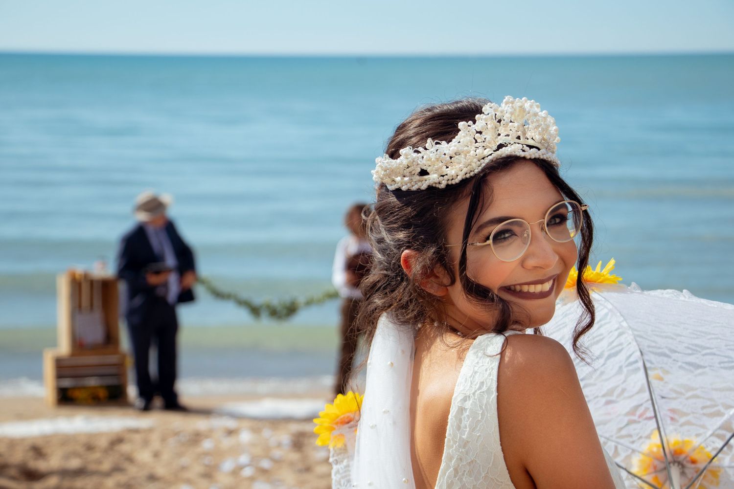 Bride smiling walking down the isle on a bright day at kitchener–Waterloo Cambridge Region