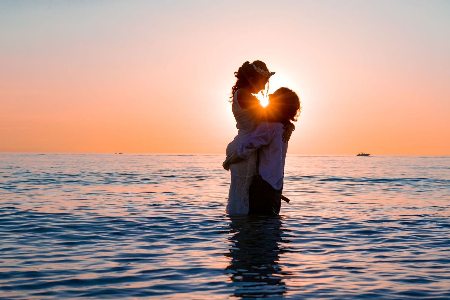 artistic photo of couple with a romantic sunset on the lake at kitchener–Waterloo Cambridge Region