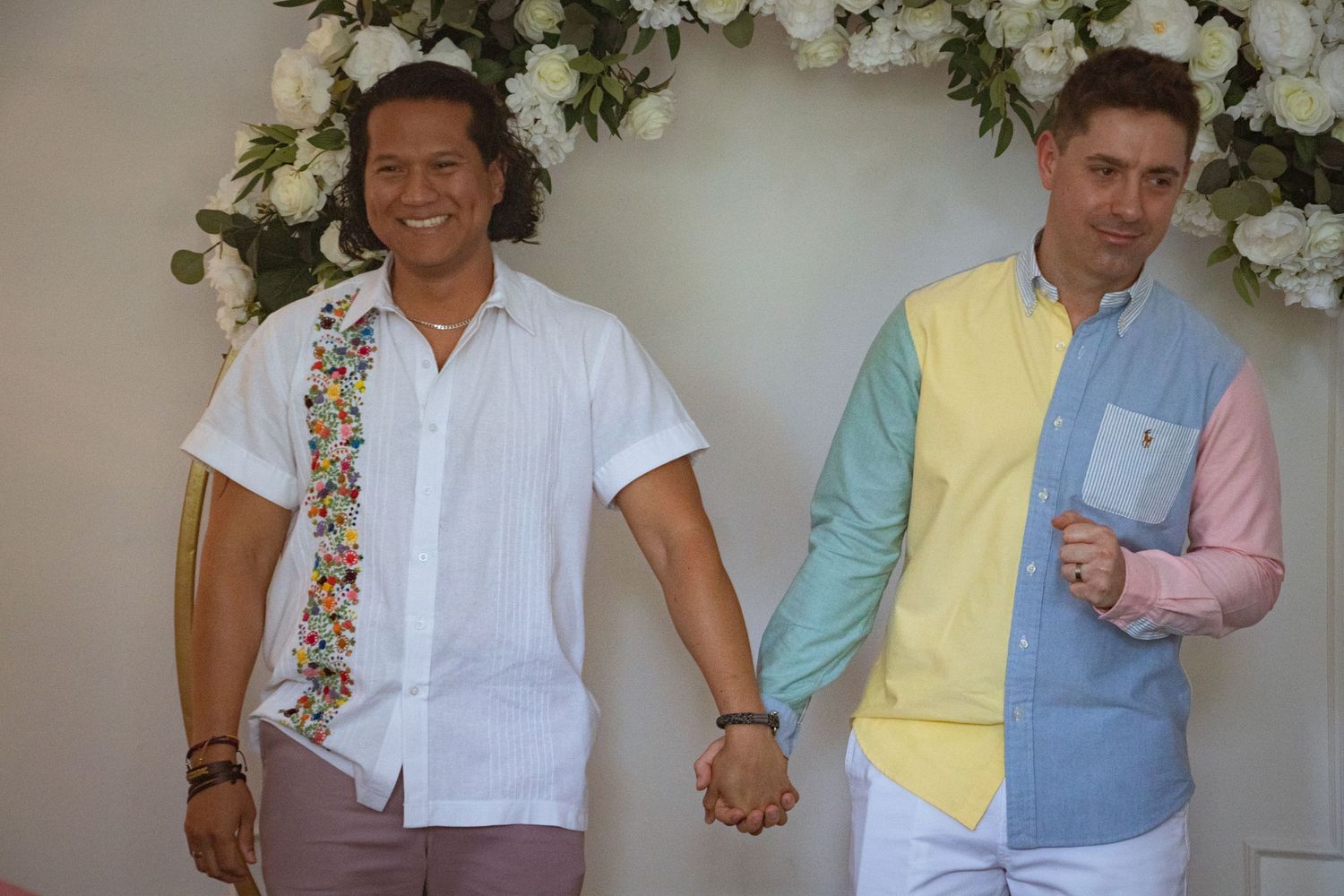grooms holding hands and sharing with guests at kitchener–Waterloo Cambridge Region