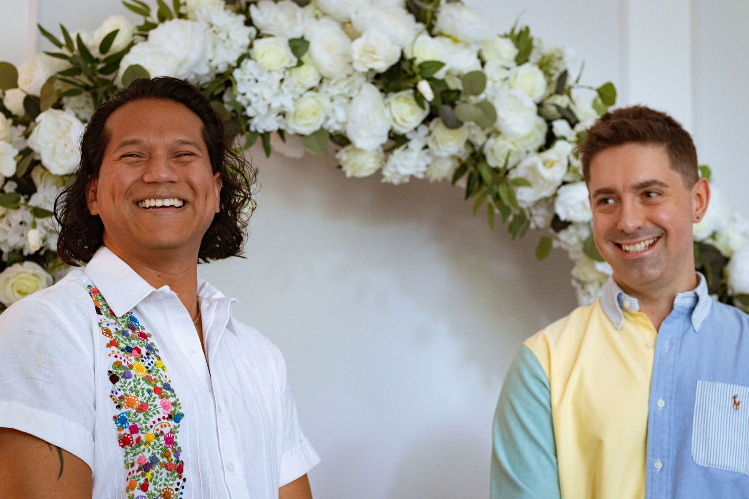 grooms smiling at the altar at kitchener–Waterloo Cambridge Region