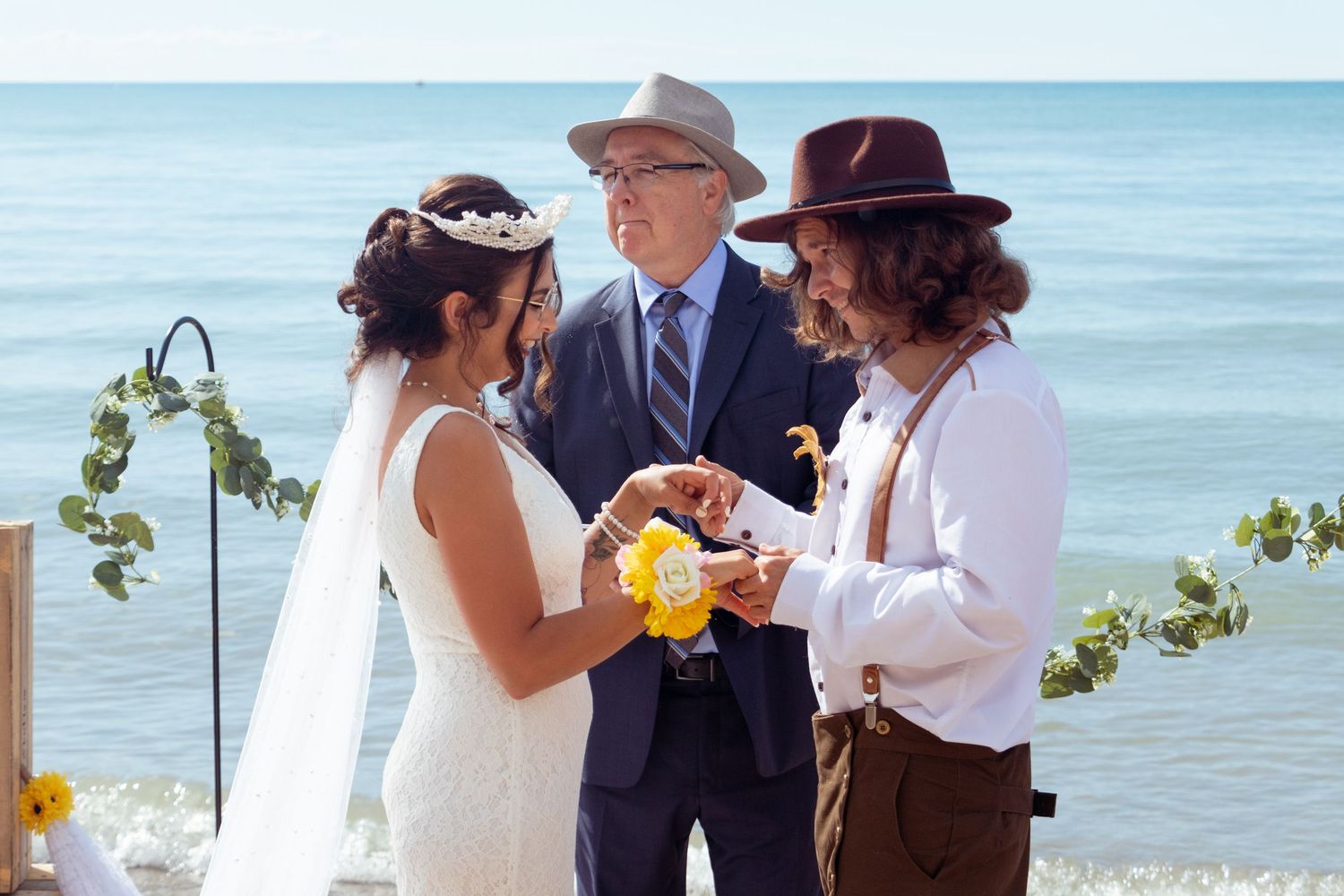 bride and groom at the altar exchanging vows at kitchener–Waterloo Cambridge Region