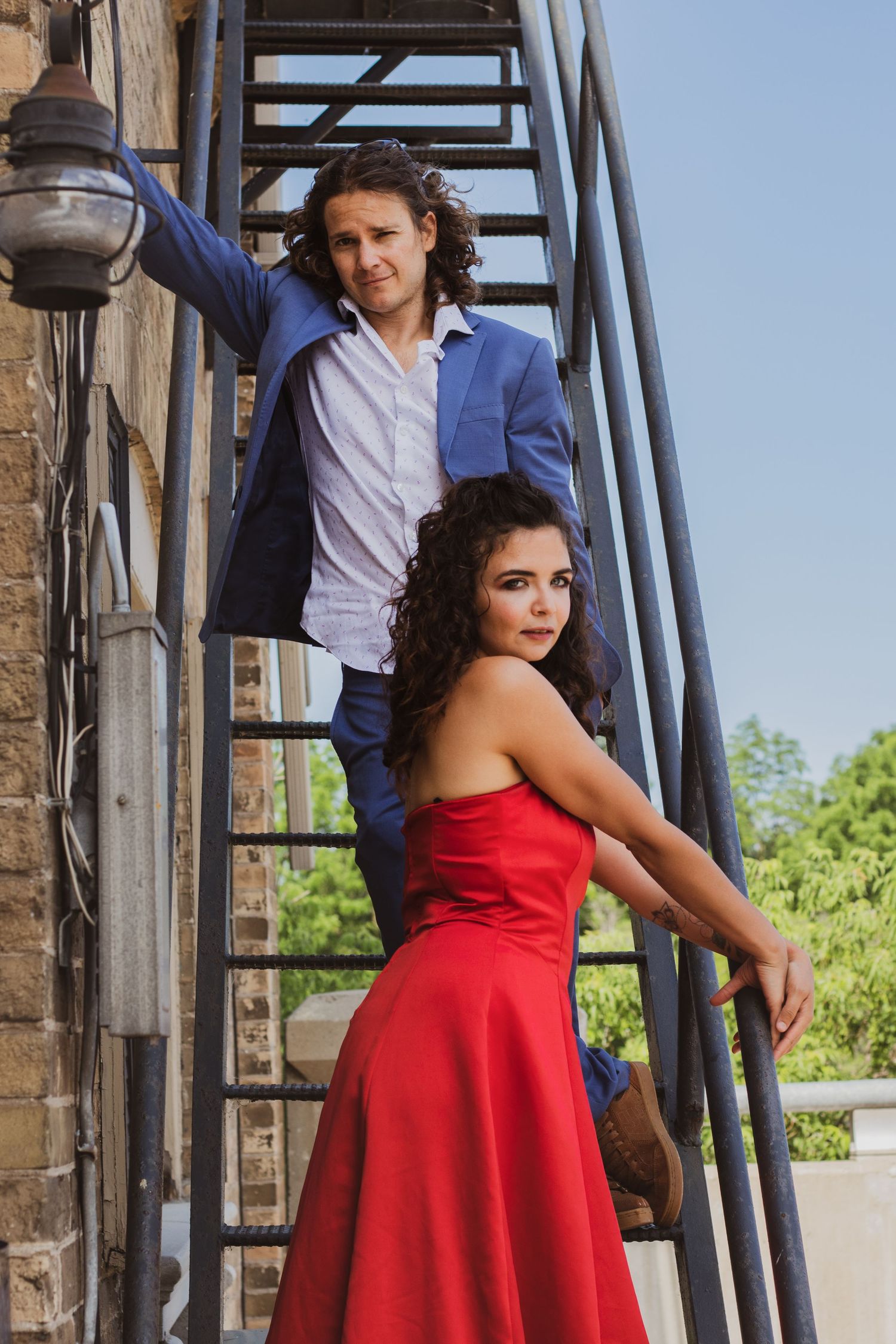 engagement picture of couple on a staircase engagement photo of bride and groom under moody bridge in the Kitchener-Waterloo region