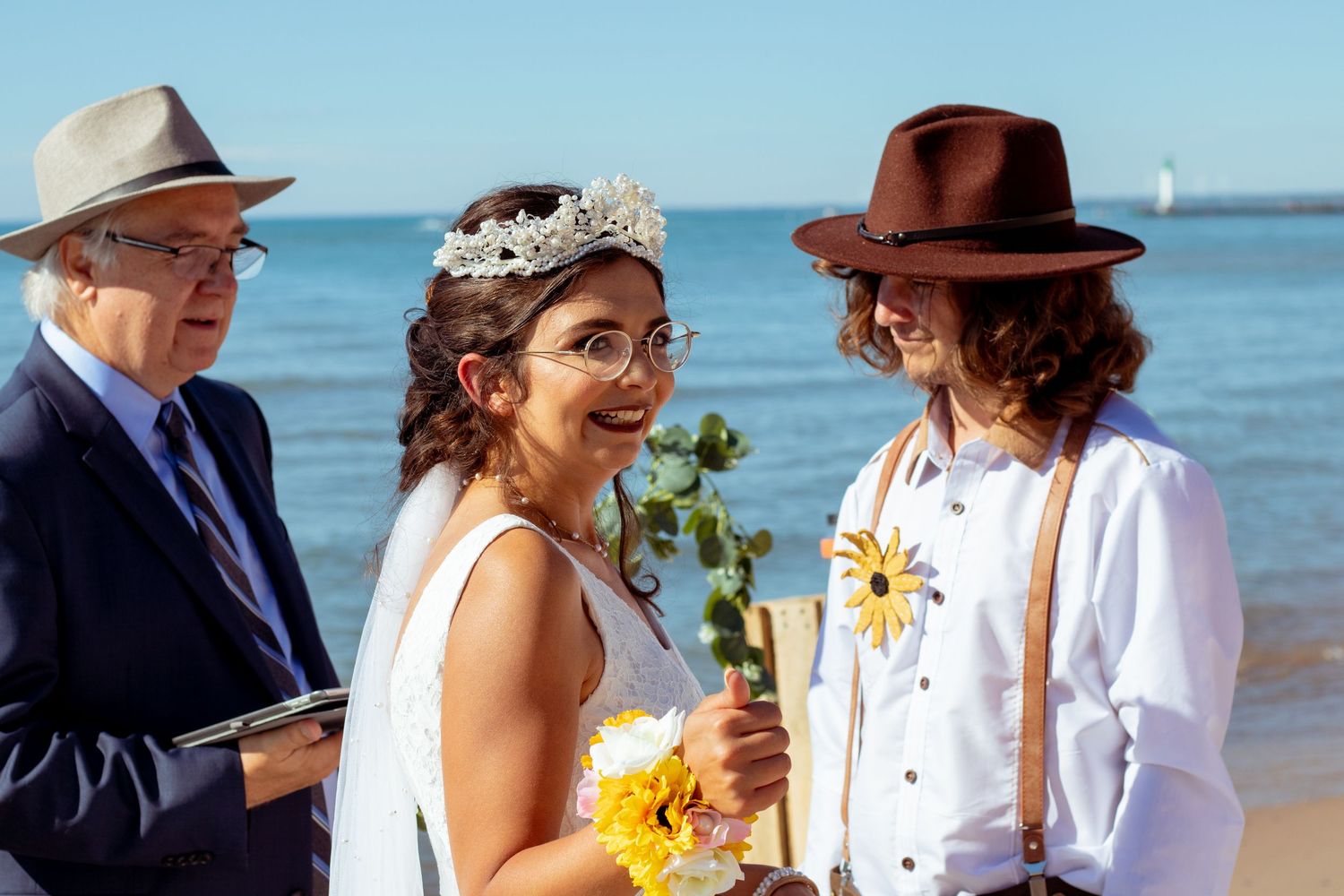 bride sharing a smile and a thumbs up to the camera with emotion at kitchener–Waterloo Cambridge Region