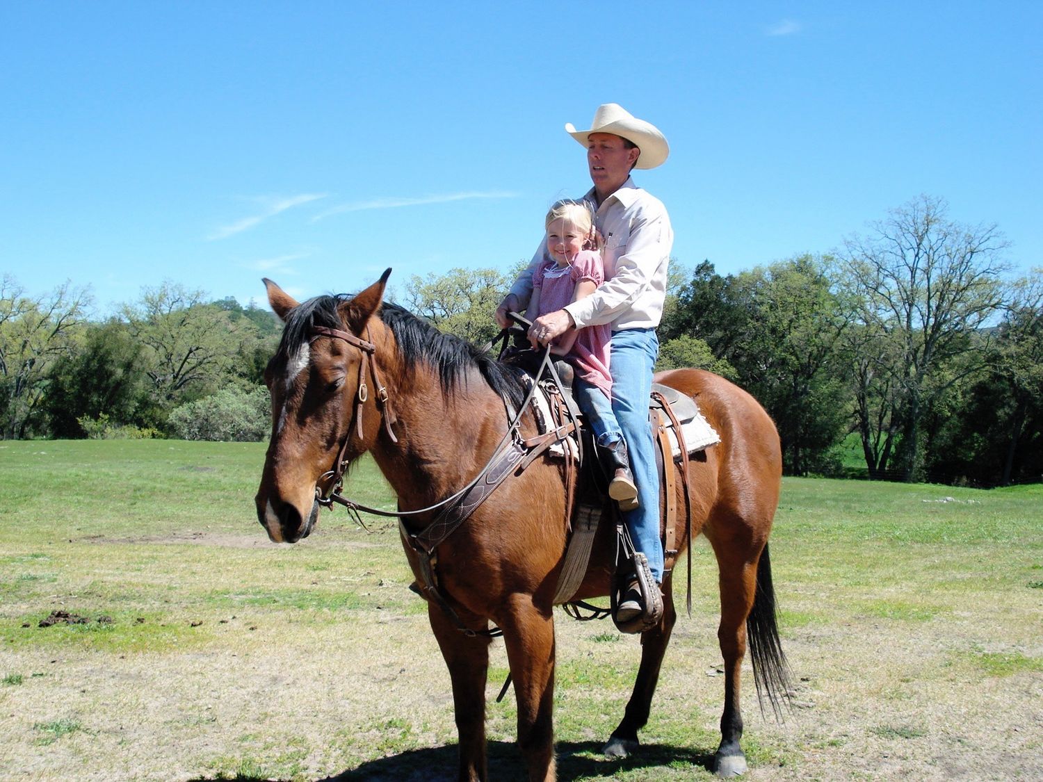 me and my papa! grew up around horses and ranching!