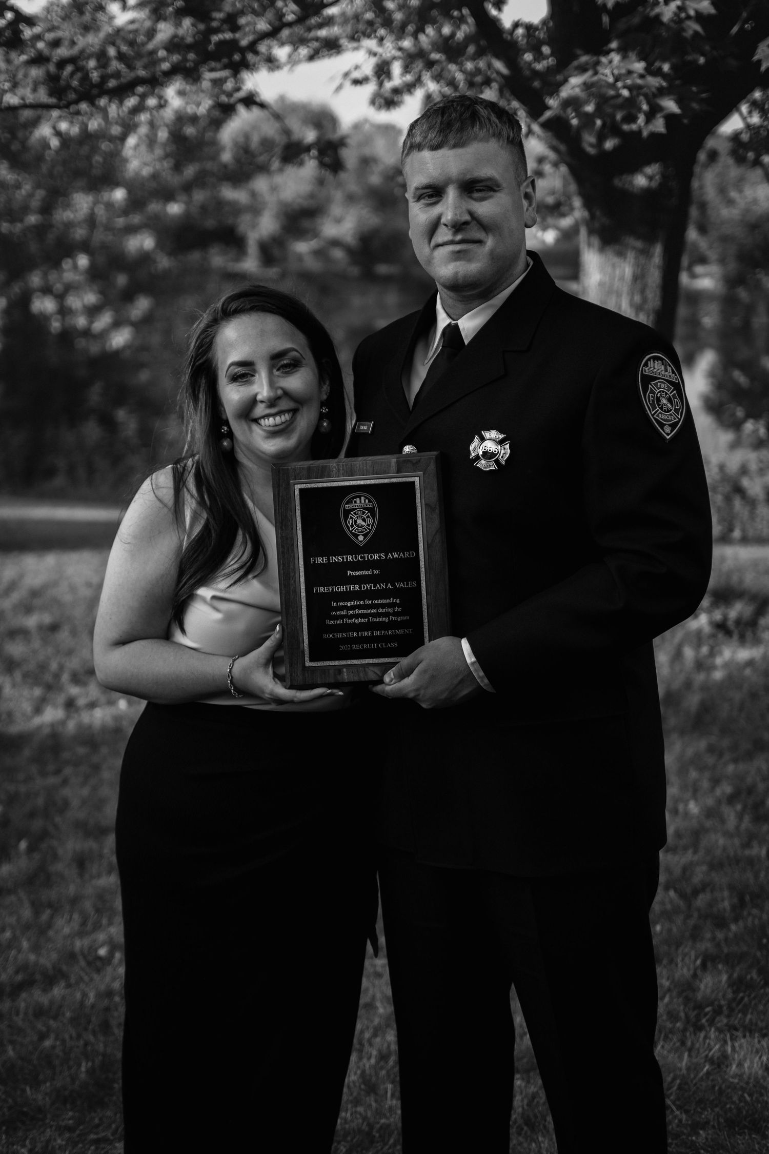 B&W high-contrast photo of couple at City of Rochester NY Fire Academy graduation.  RFD Fire Instructor's Award recipient.