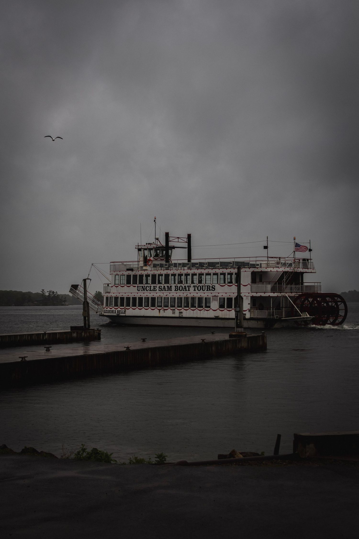 Moody, high-contrast photo of the Uncle Sam Boat Tours paddlewheeler near Boldt Castle, Alexandria Bay, NY. The Chronicle session.