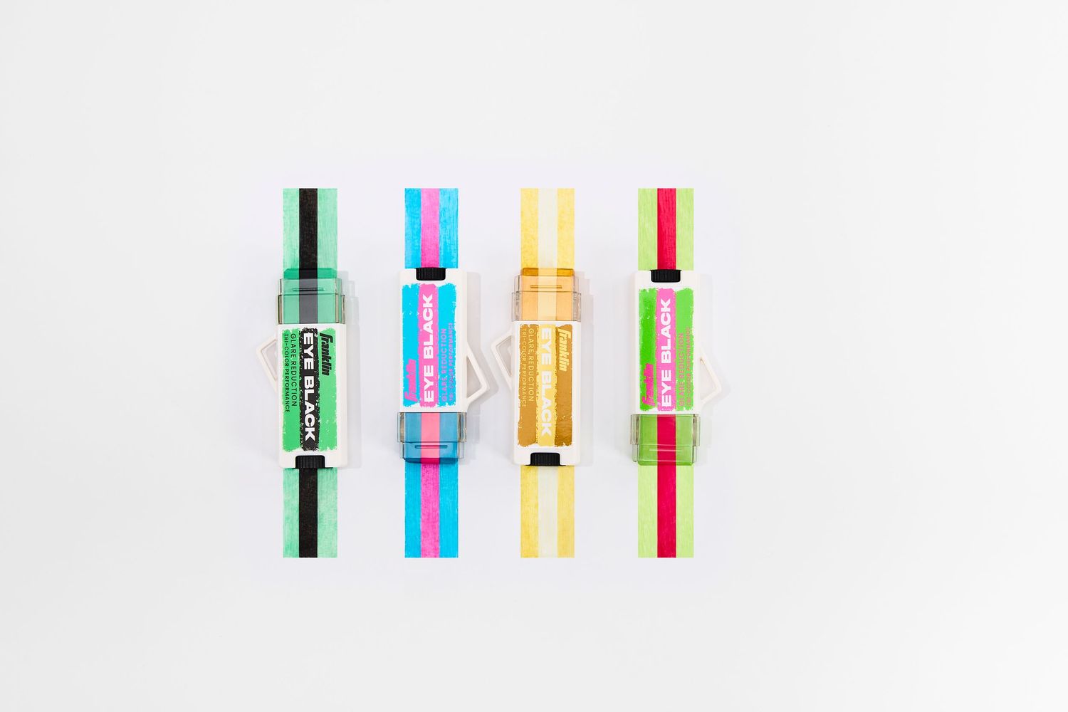 A set of colorful eyeblack in different styles and materials displayed on a white background.