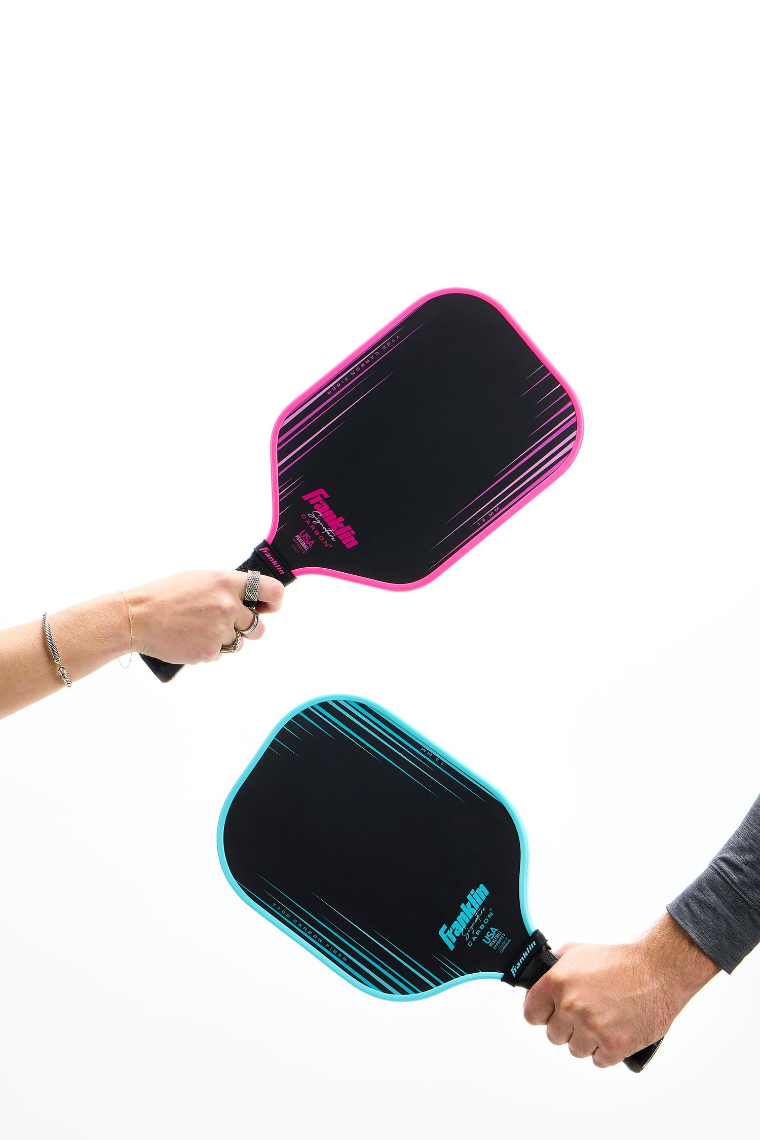 Four sequential images showing hands holding a black pickleball paddle with neon colored edge details from different angles.