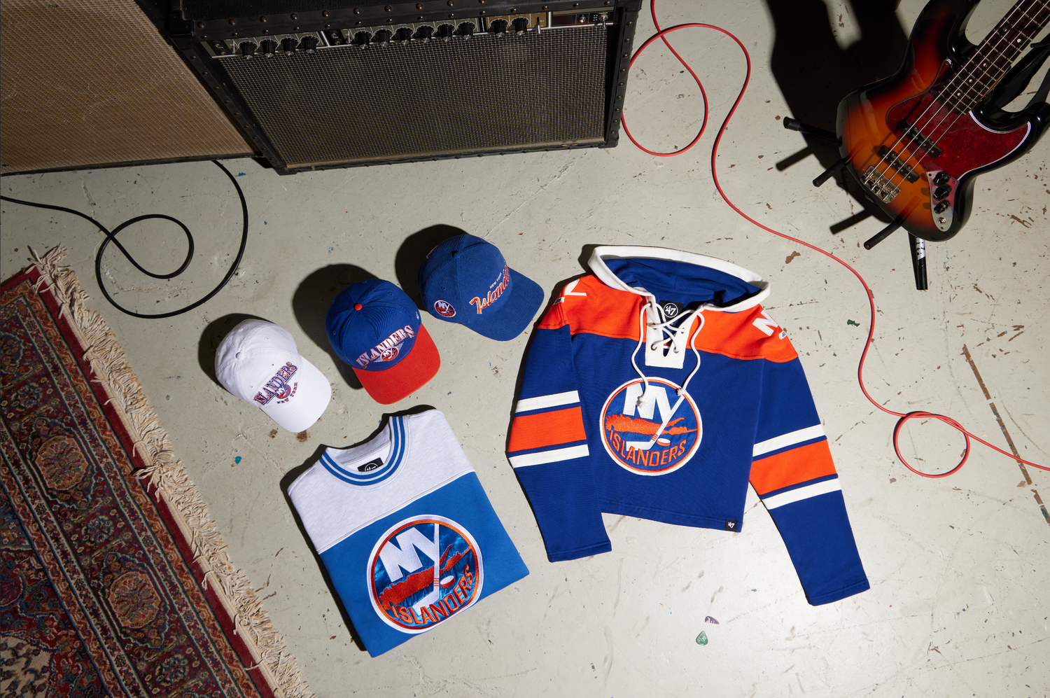 A hockey jersey is being customized with stitching and embroidery details on a white work surface.