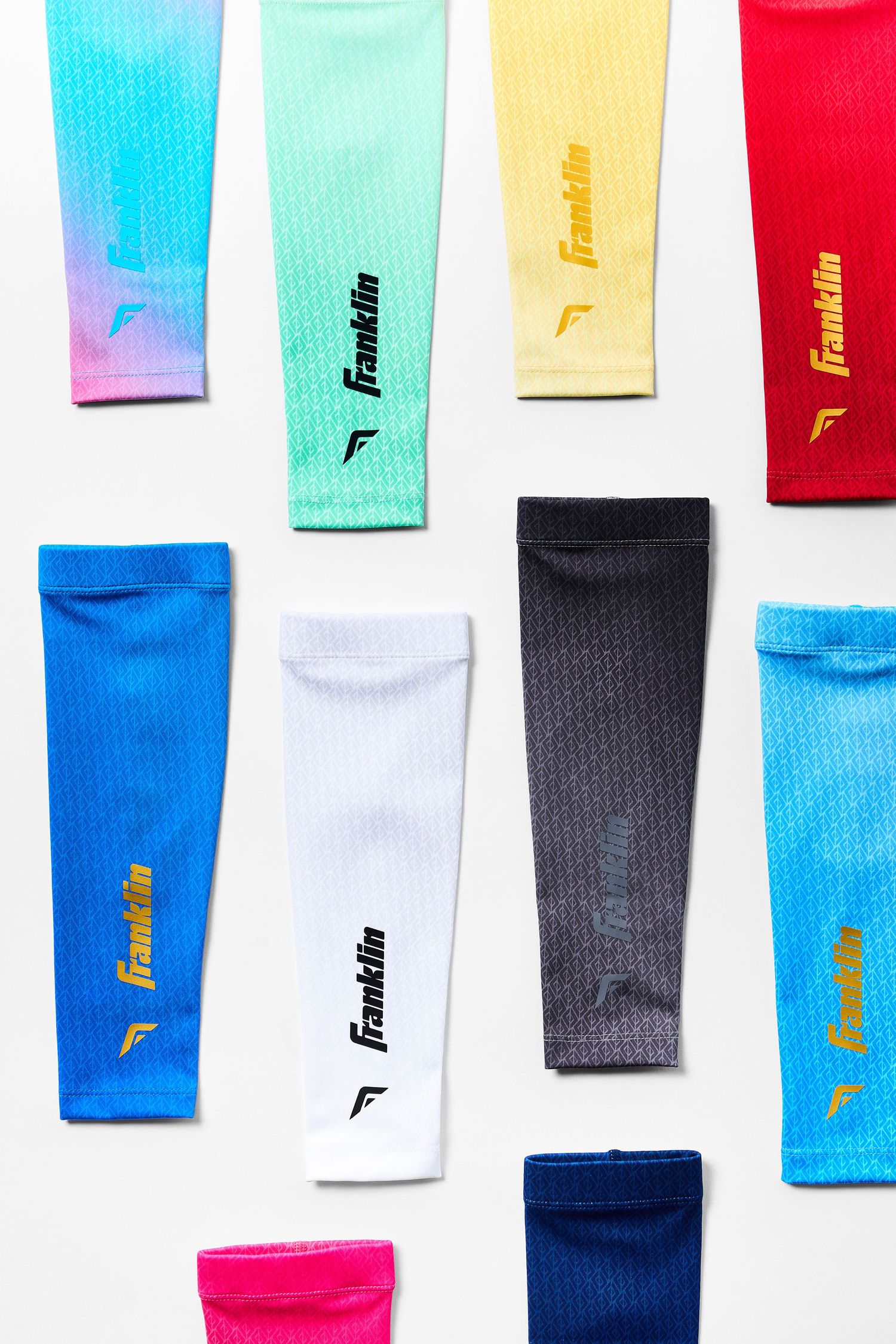Colorful collection of athletic compression sleeves in blue, mint, yellow, red, white, black and pink with Franklin branding.