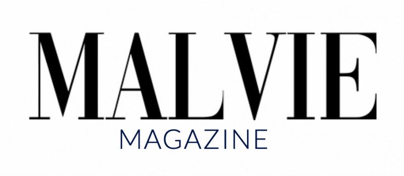 Magazine logo text in black typography on white background.