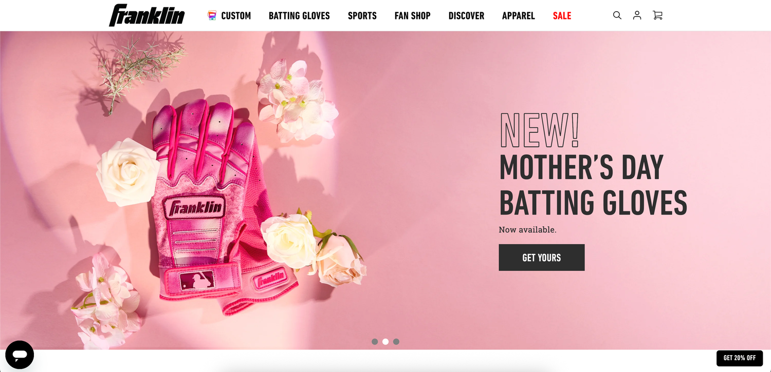 Pink website header design with Mother's Day batting gloves product banner and navigation menu.
