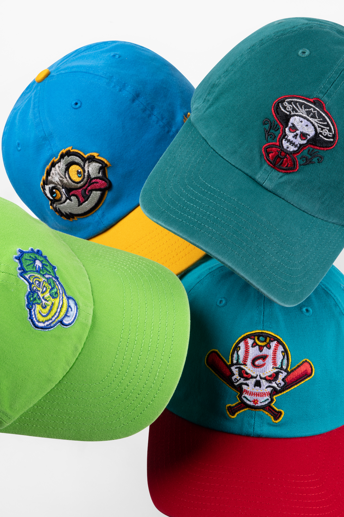 Colorful baseball caps with cartoon character patches displayed in a repeating pattern against white background.