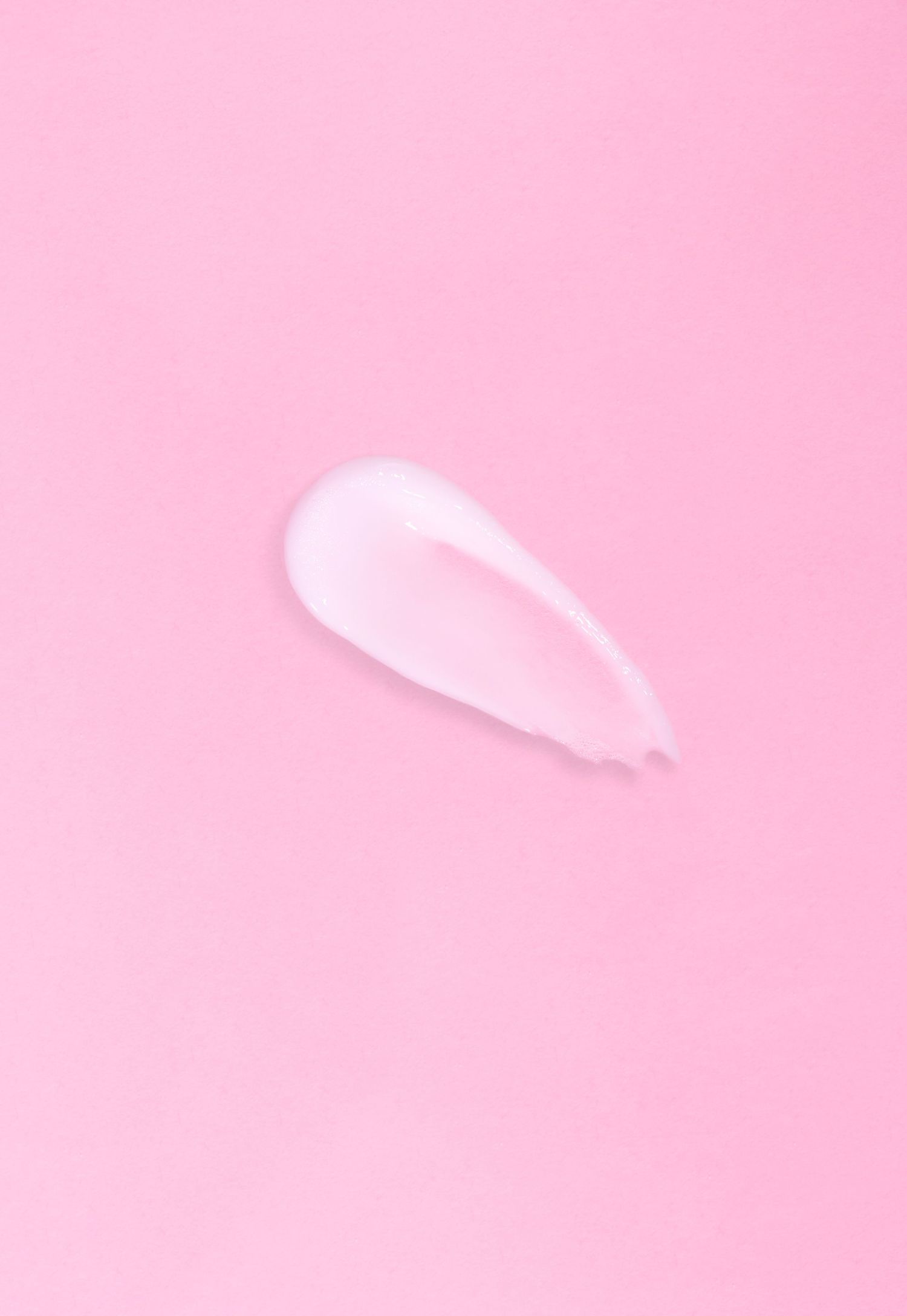Abstract pink gradient background with soft feathered texture and light tonal variations.