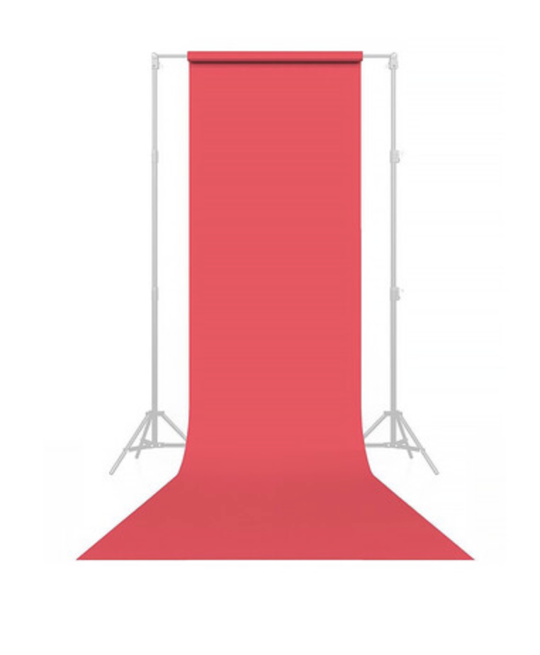 Red seamless paper backdrop on a white photography stand, ideal for professional photo shoots and studio setups.