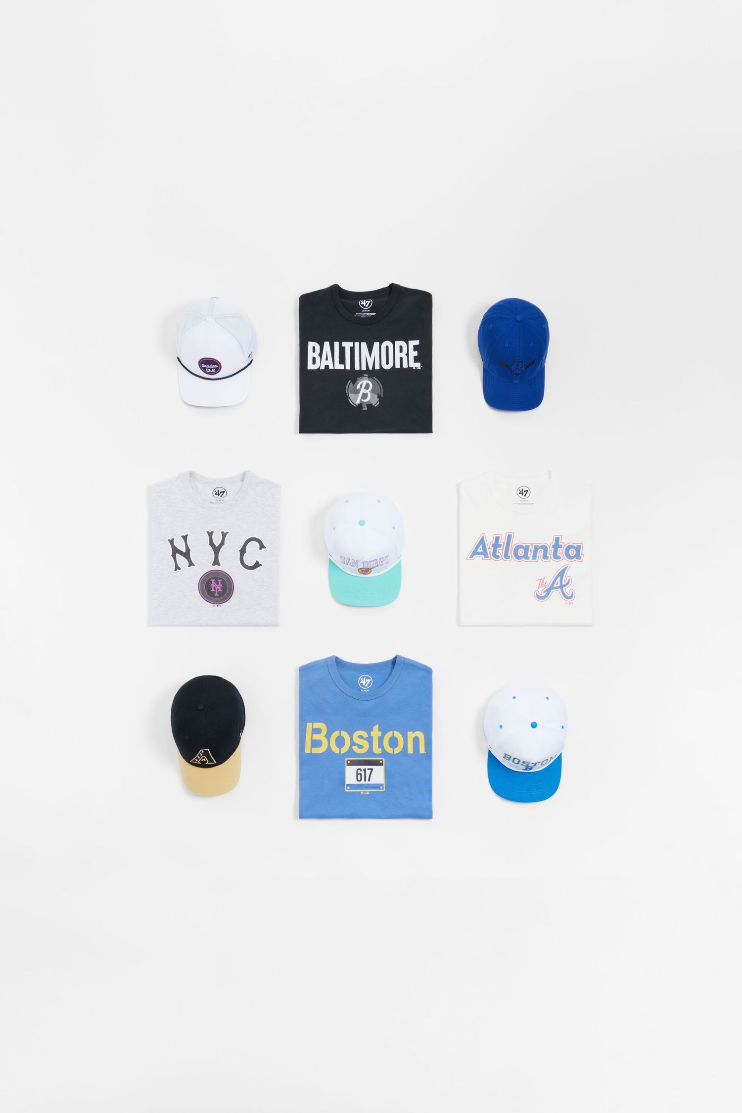 Collection of baseball caps and t-shirts featuring MLB team logos including Baltimore, Atlanta, and Boston merchandise.