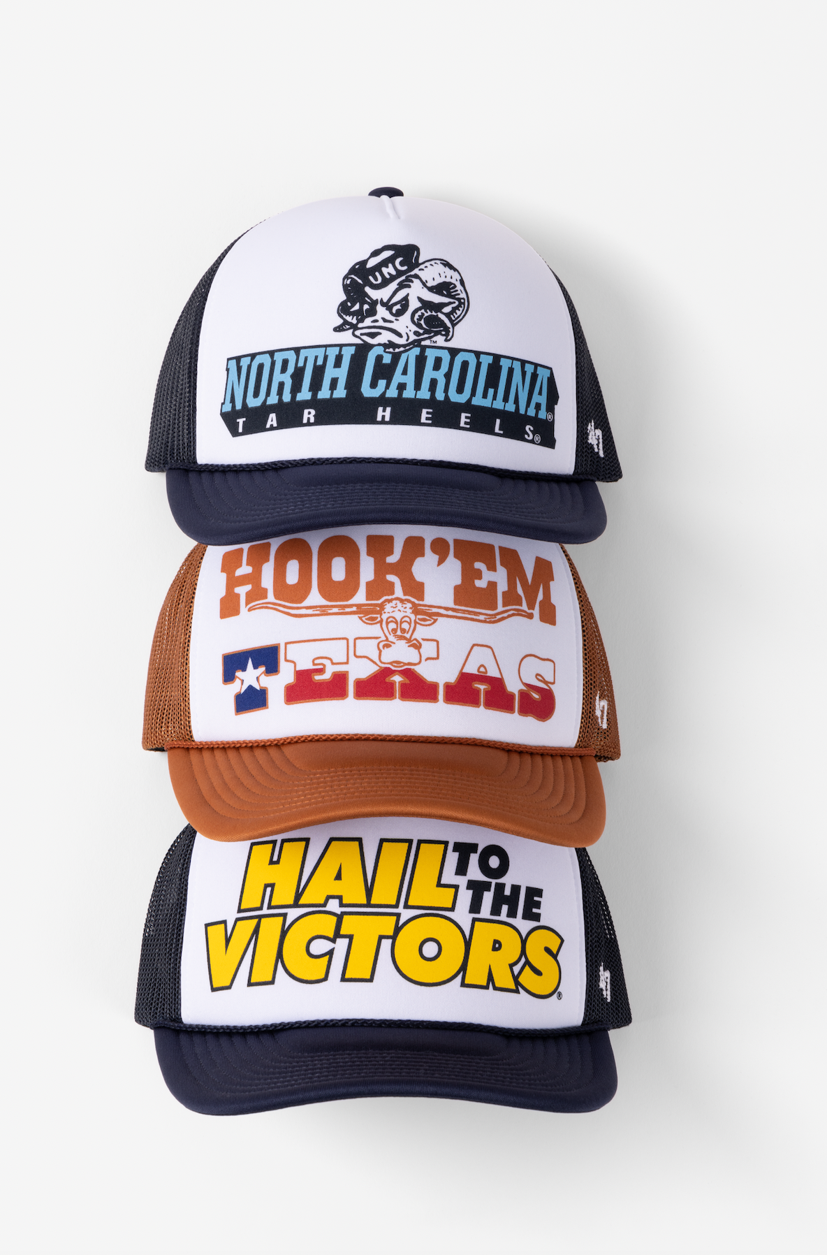 Collection of vintage-style trucker hats with retro graphics and slogans in white, navy, and brown color combinations.