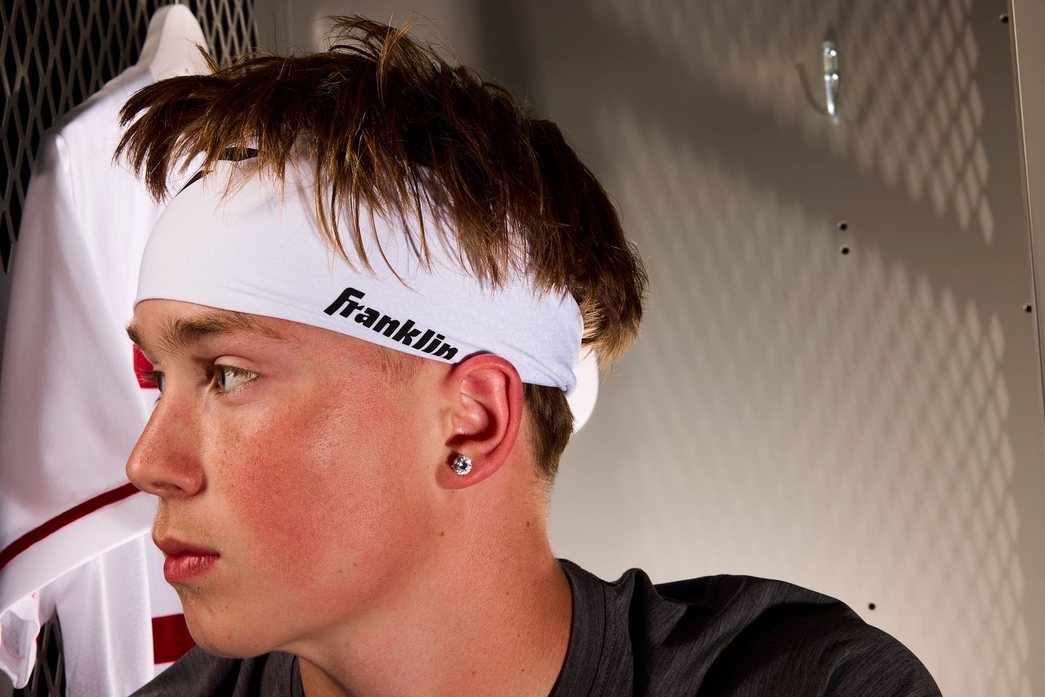 A swimmer wearing a white Franklin swim cap is shown in multiple profile angles against a light background.