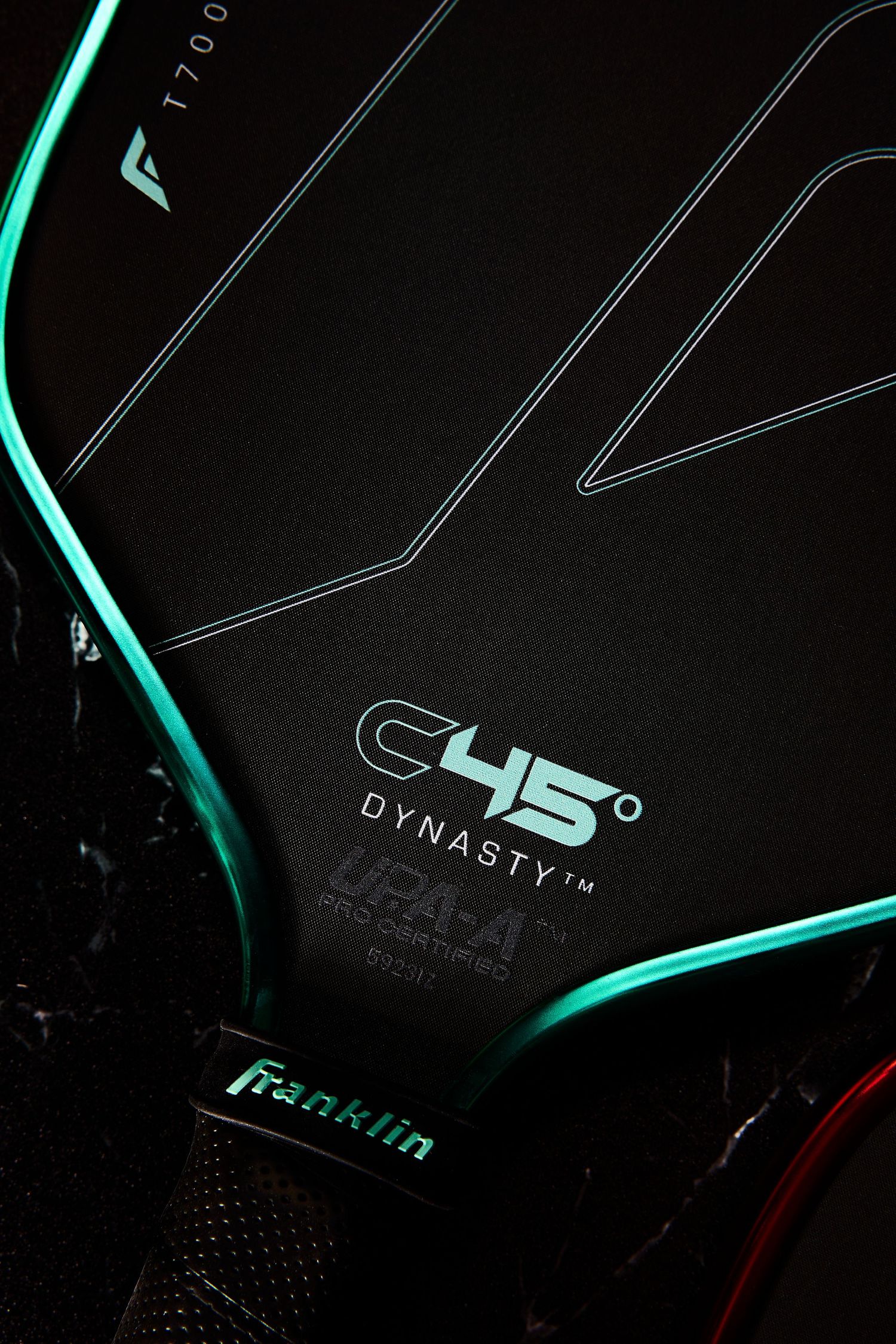 Close-up shots of black gaming equipment with glowing turquoise LED accents against dark background.