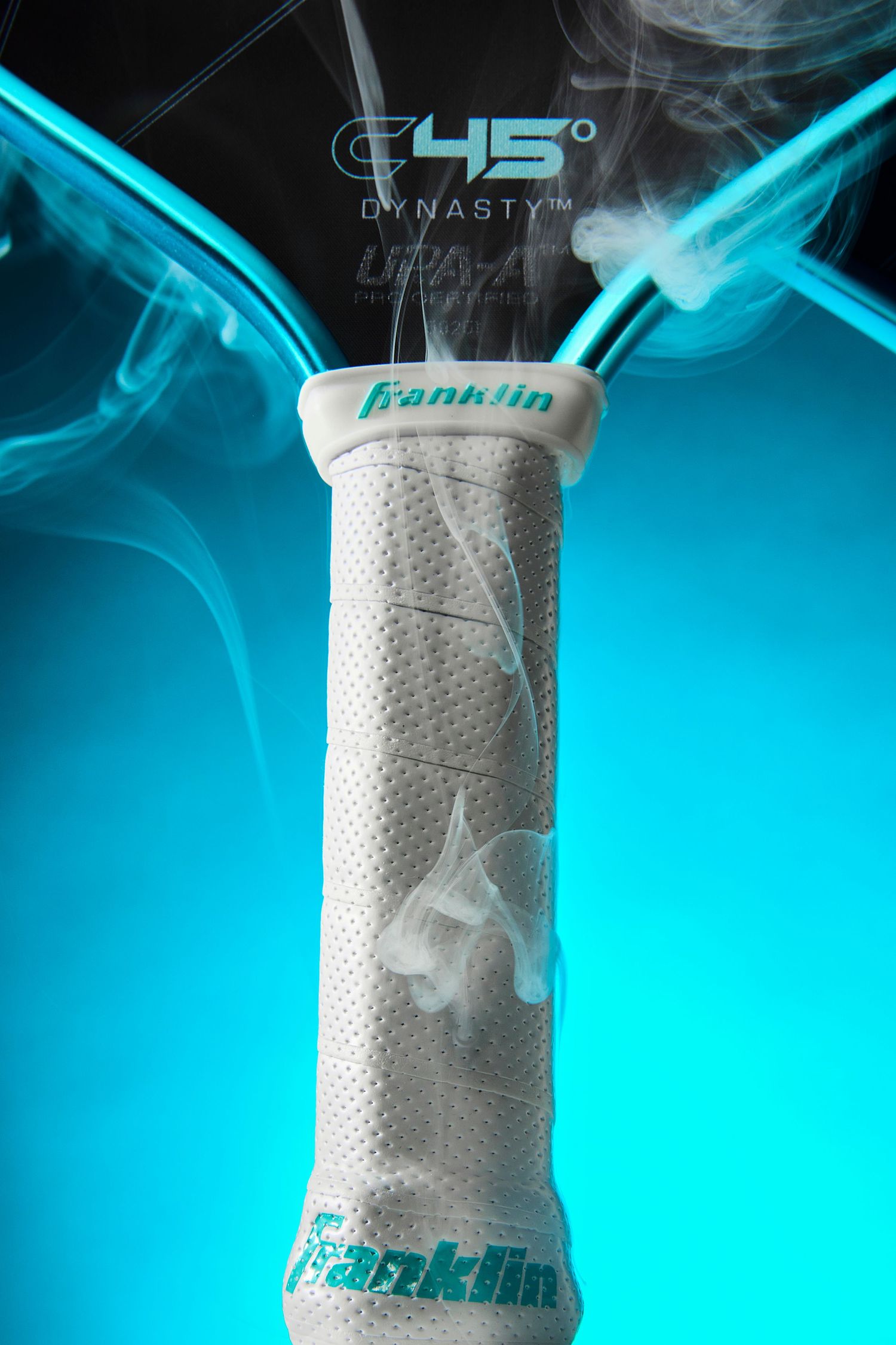 Close-up sequence of white Franklin sports grip tape with logo against vibrant turquoise background.