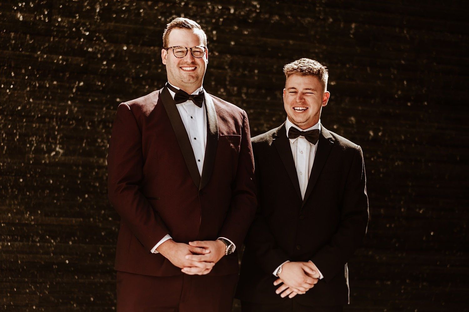 Groom and best men with historic Michigan architecture in the background