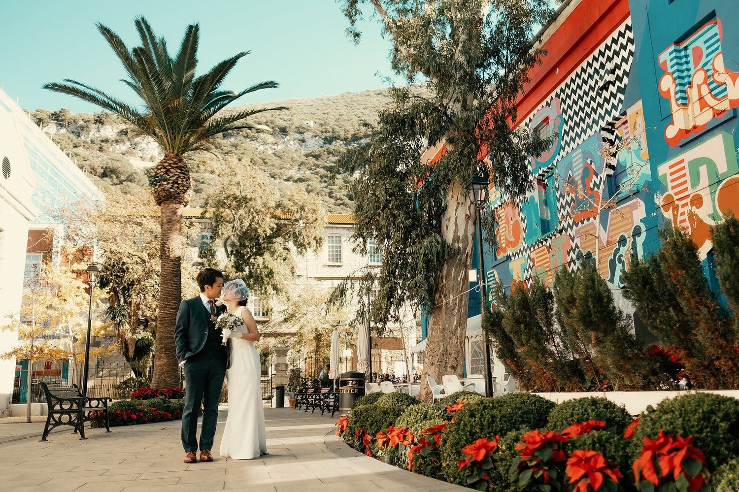 Urban style wedding photography bride and groom walking in Gibraltar city center