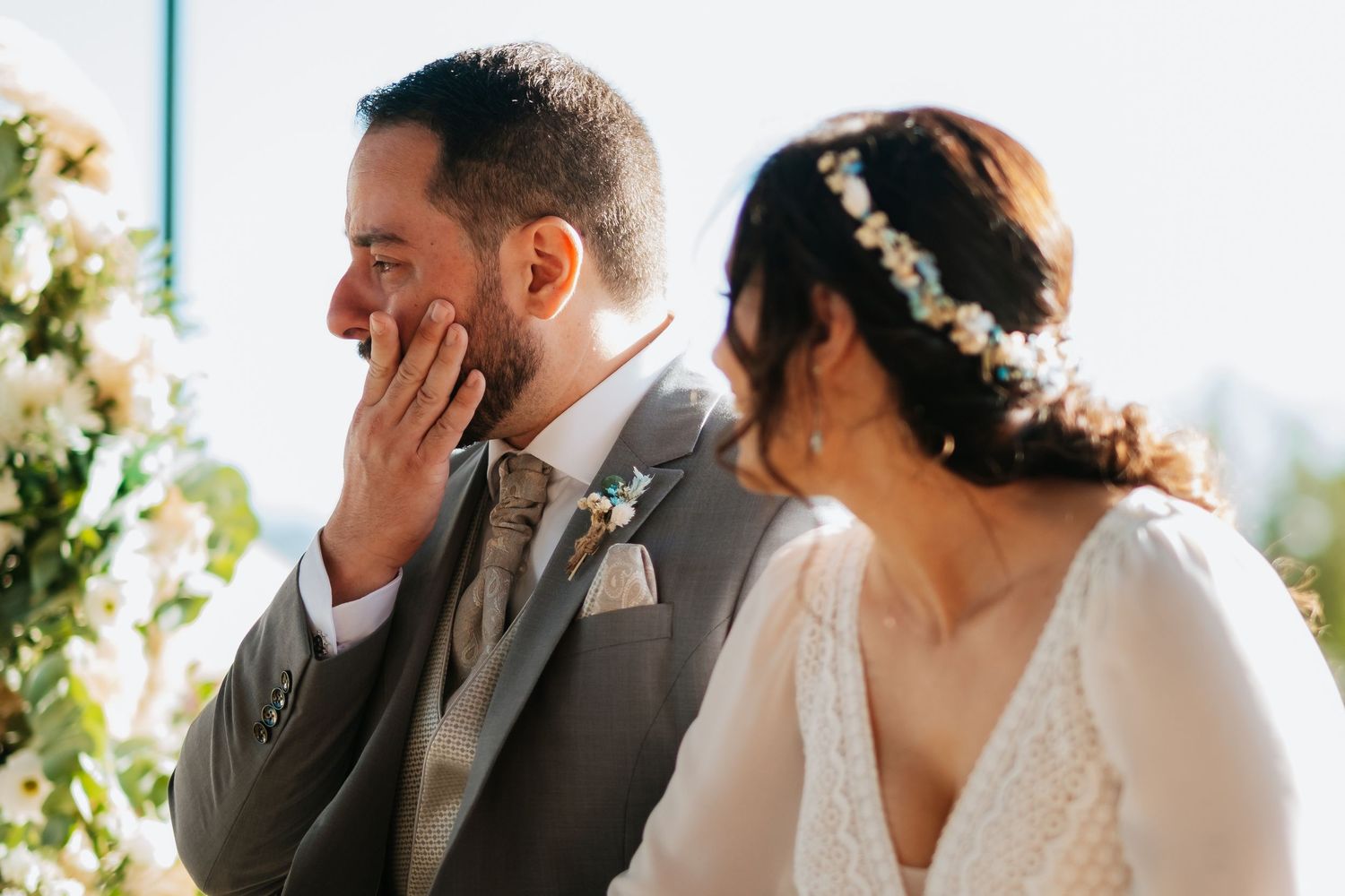 Emotional wedding first look moment captured in a series of candid photos outdoors.