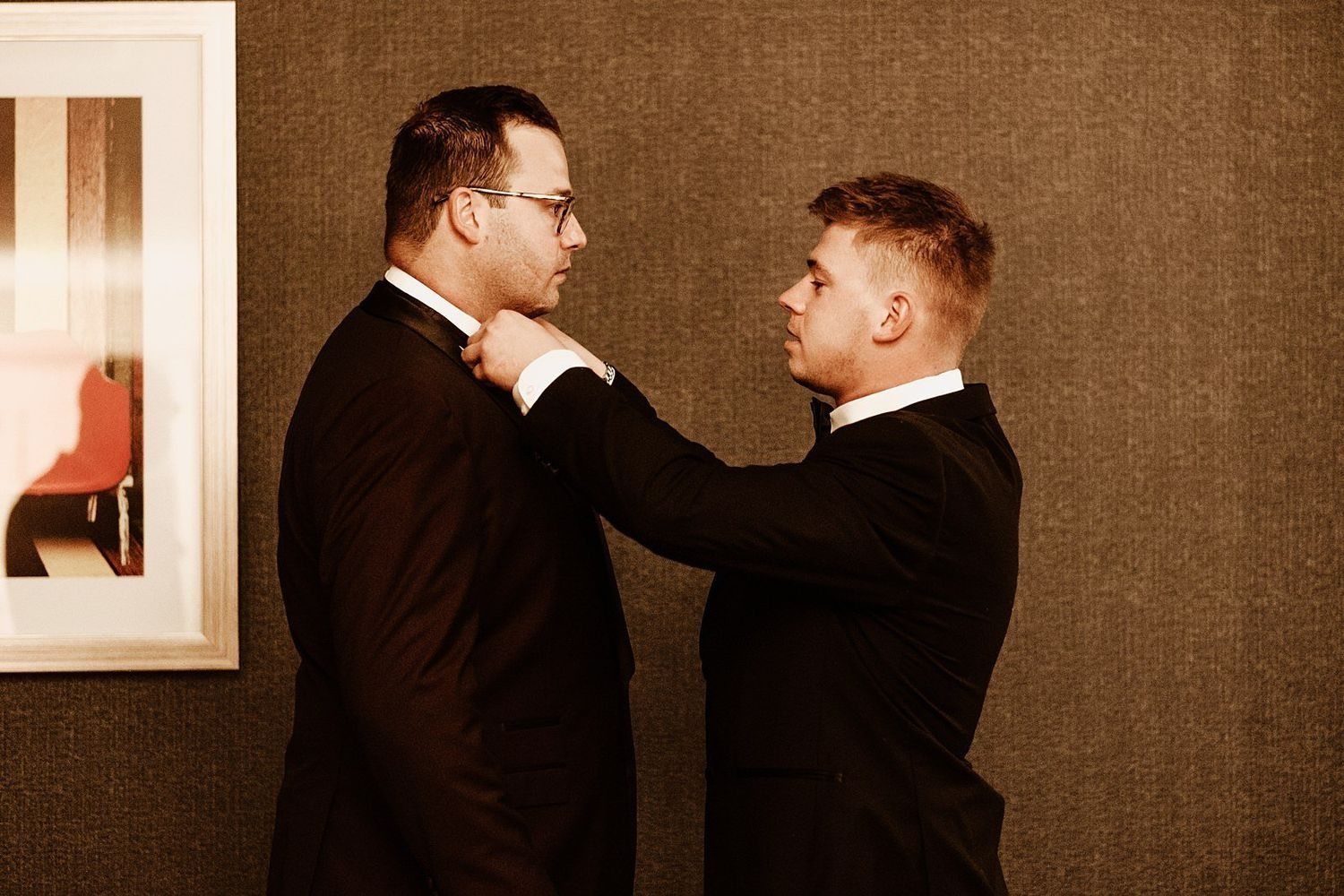 Karel’s final suit adjustments before the wedding ceremony