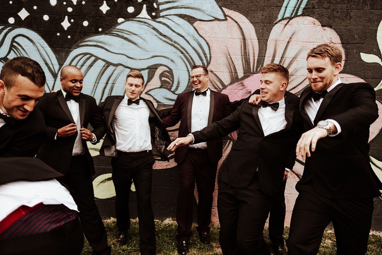 Fun and candid wedding guests enjoying the lively party with the newlyweds in Michigan