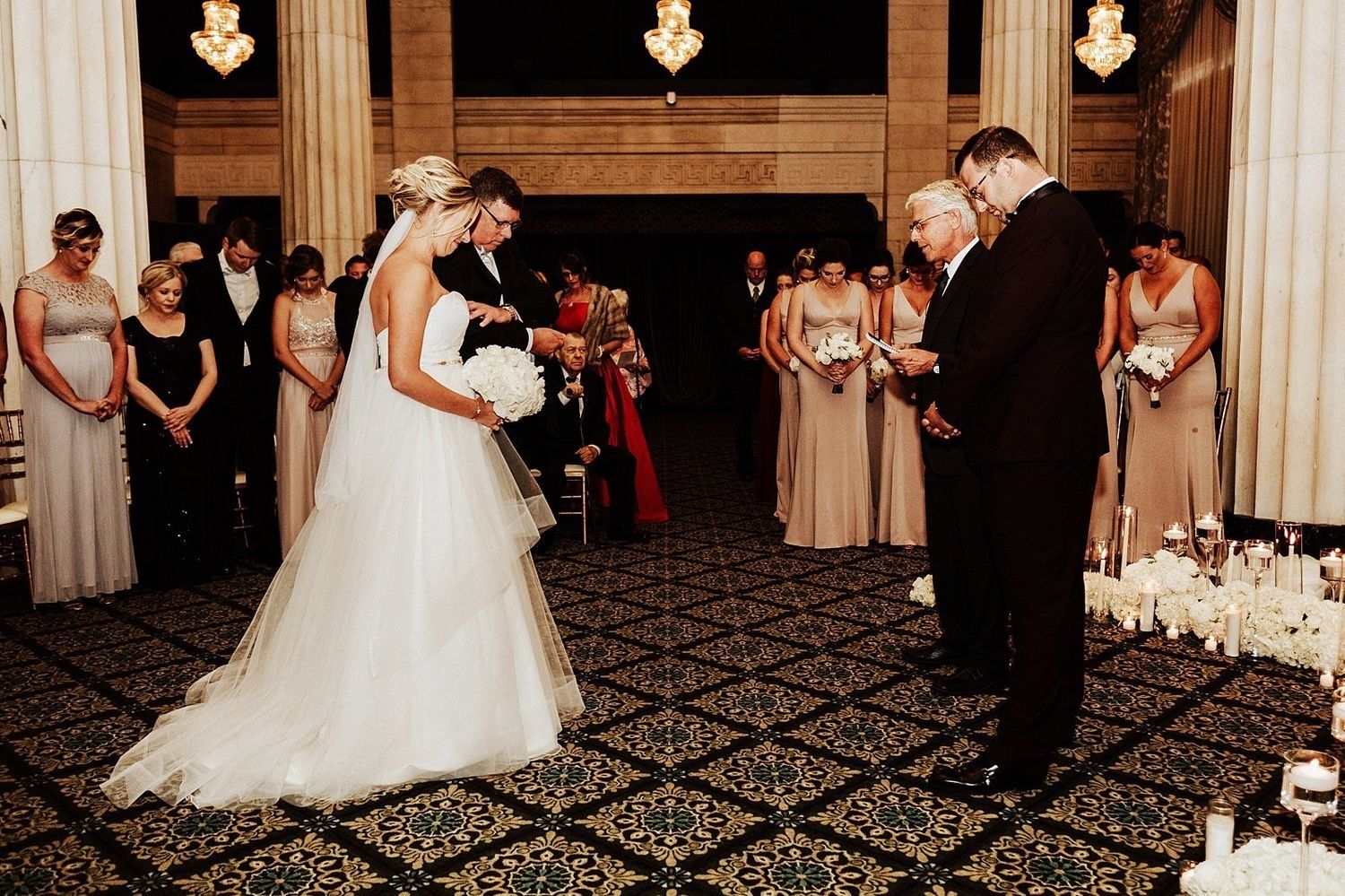 Shannon and Karel standing at the altar during their wedding ceremony in Grand Rapids