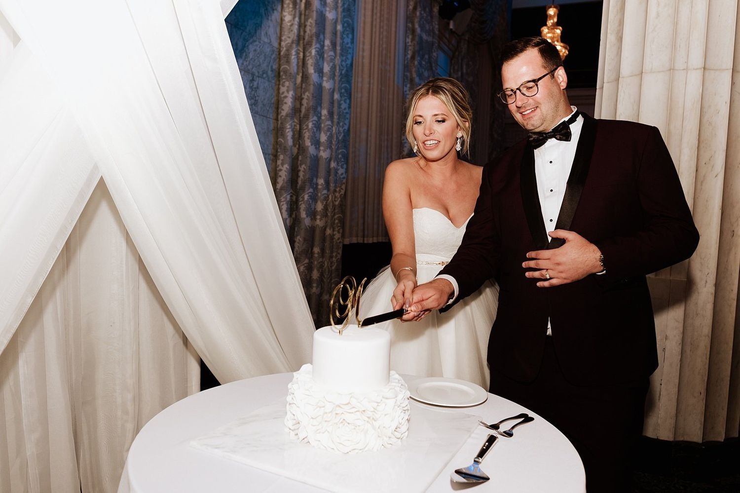 Shannon and Karel performing the traditional cake cutting during their reception in Grand Rapids