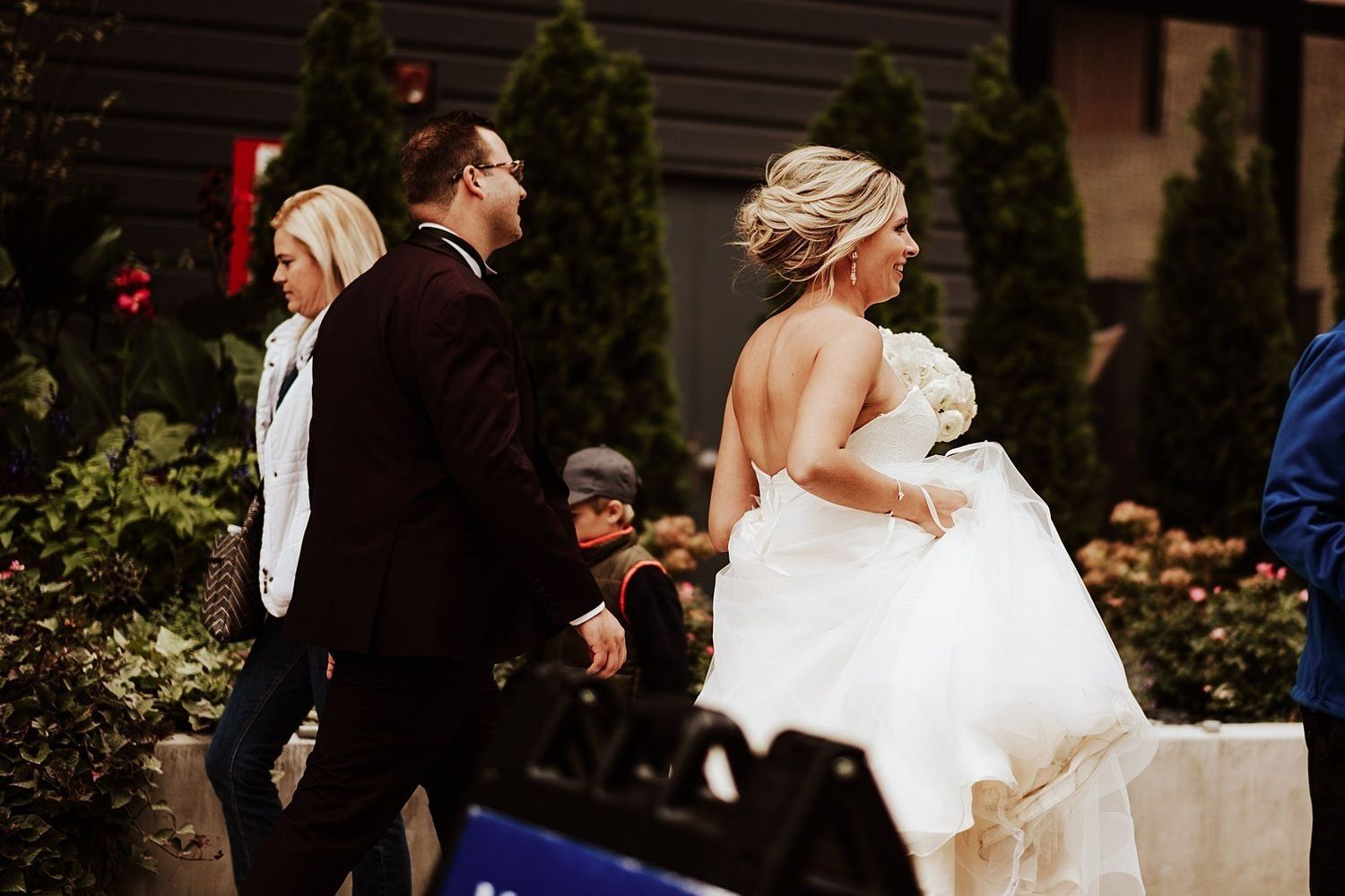 Shannon and Karel walking through downtown Grand Rapids as local citizens look on.