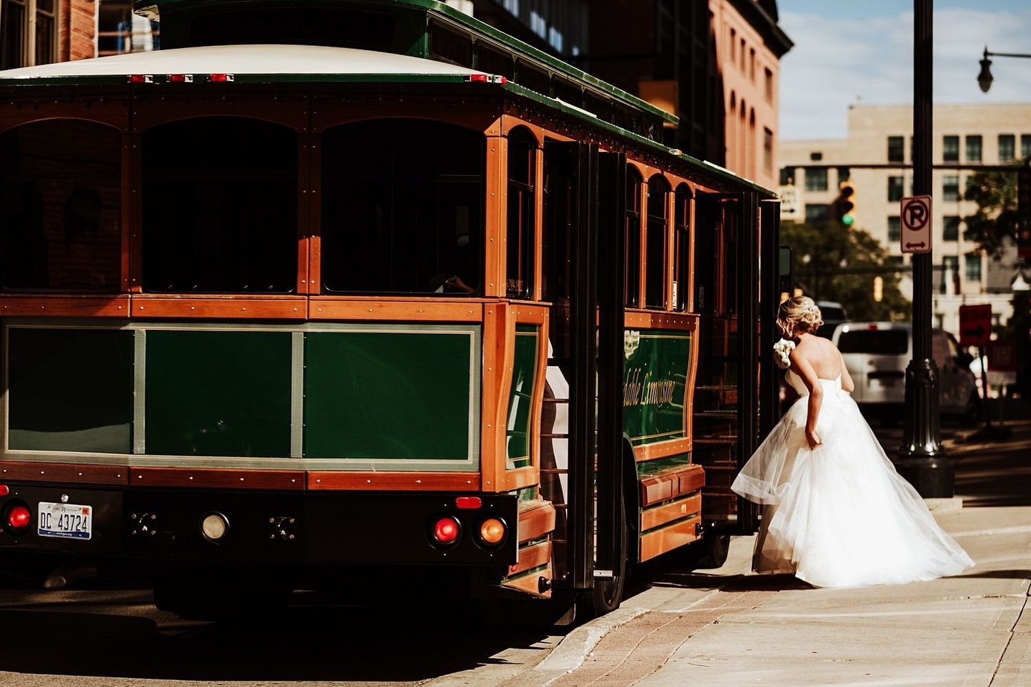 Shannon and Karel boarding the classic Grand Rapids wedding Trolley for their city tour