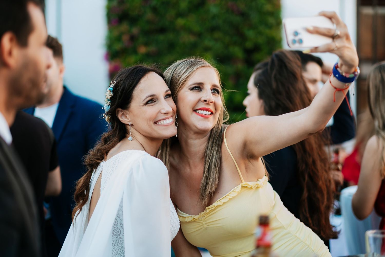 Wedding guests enjoying themselves during an outdoor reception celebration.