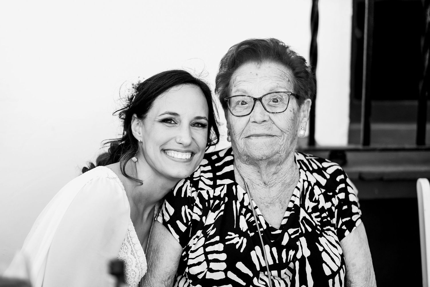 Black and white candid wedding portraits showing joyful emotional moments.