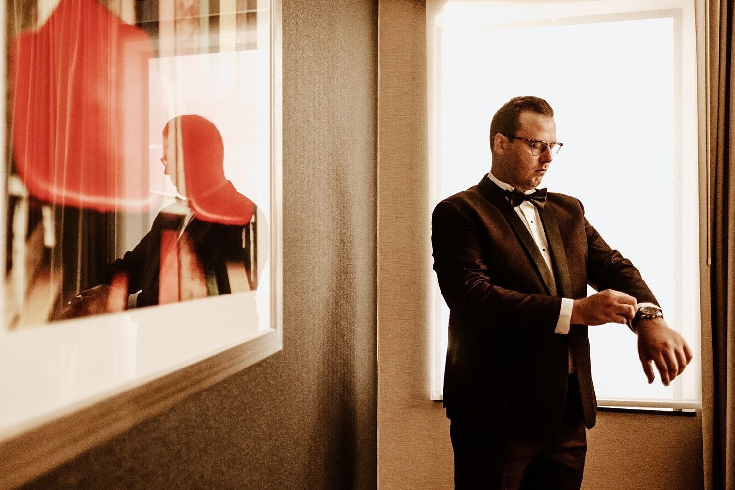 Groom getting ready with Michigan luxury Hotel suite